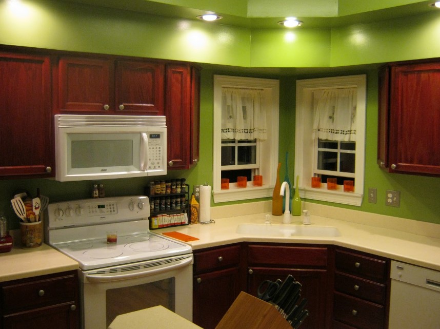 Green Color Wall With Cherry Cabinet